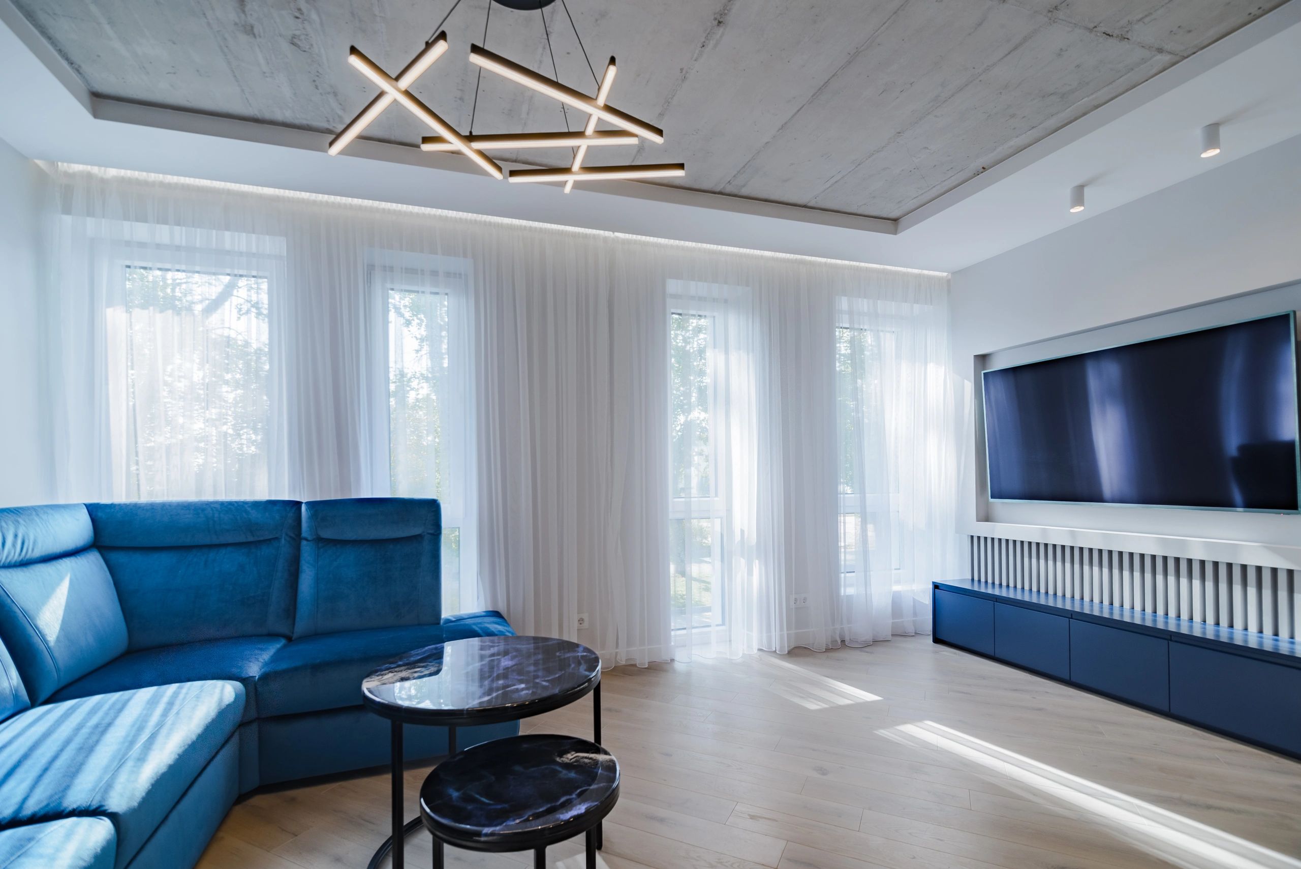 Modern living room with a large TV setup