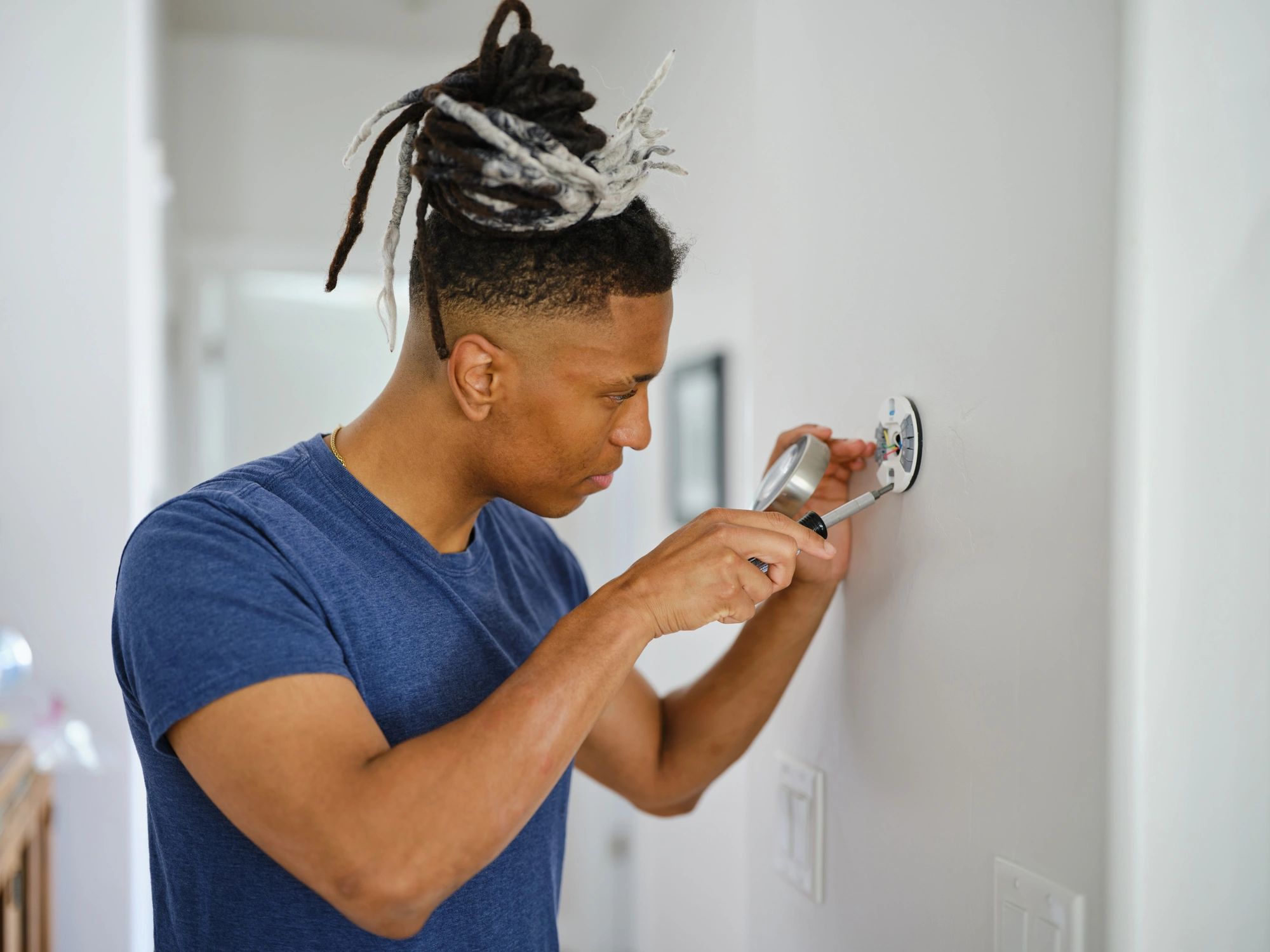 Technician installing smart home equipment neatly